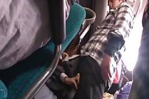 A horny man is putting his fingers in a young Japanese babe   s panties  while in the bus