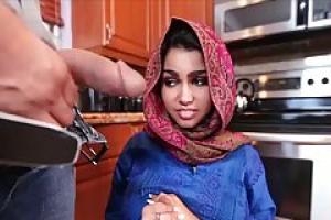 Muslim chick is wearing her favorite head scarf and getting fucked hard in the kitchen