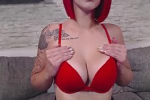Slutty redhead  Nina Devil is rubbing her warm pussy  while in front of the webcam