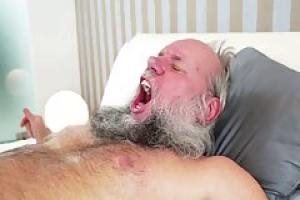 Old man with a beard is drilling a young girl   s soft pussy  while in a hotel room